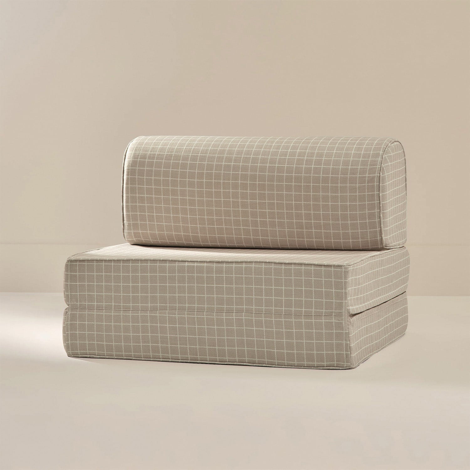 Modular sofa with grid pattern on a beige background