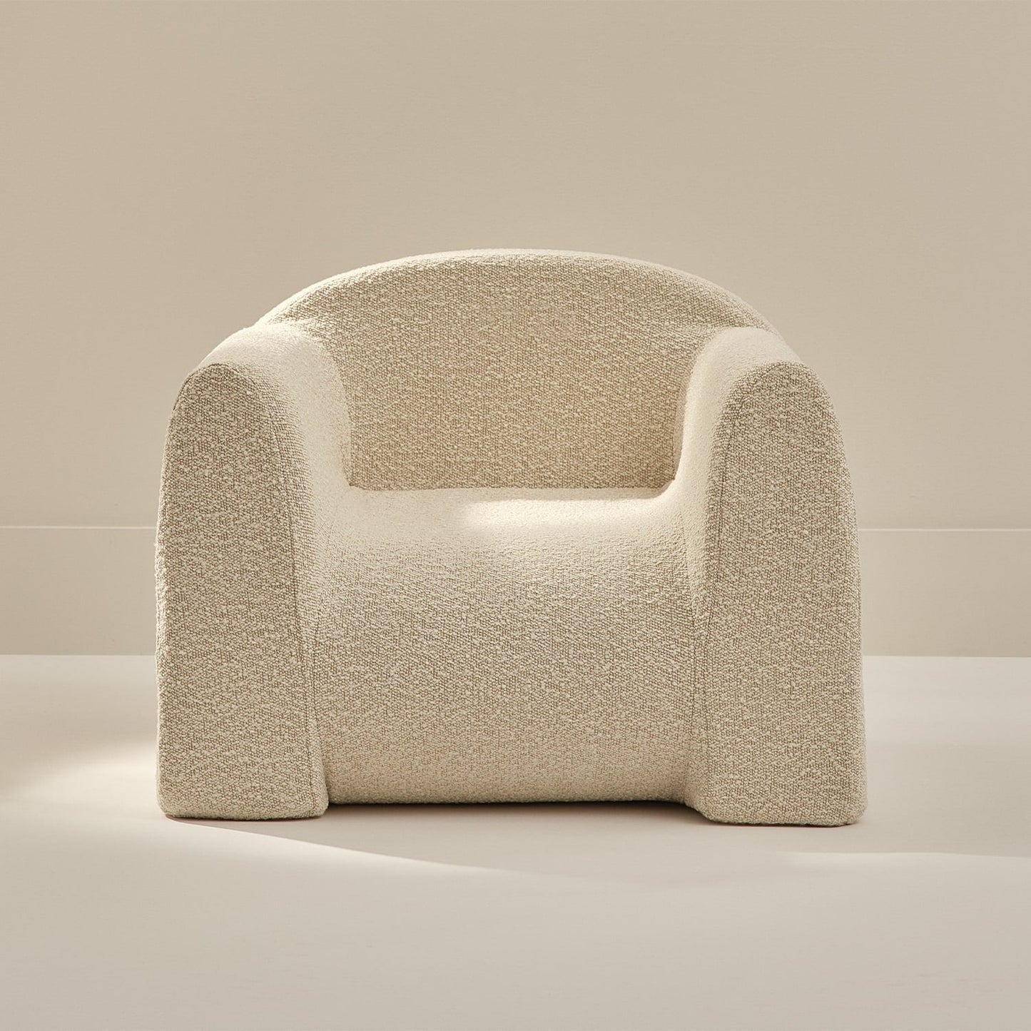 white textured armchair on a neutral background
