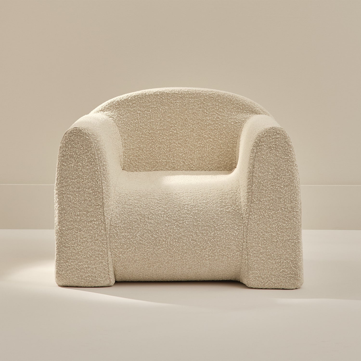 white textured armchair on a neutral background