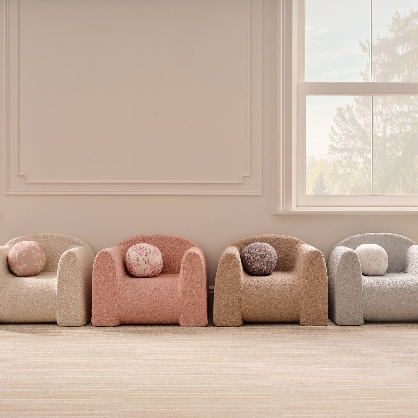 Four armchairs with round cushions in a room with a window and light-colored walls.