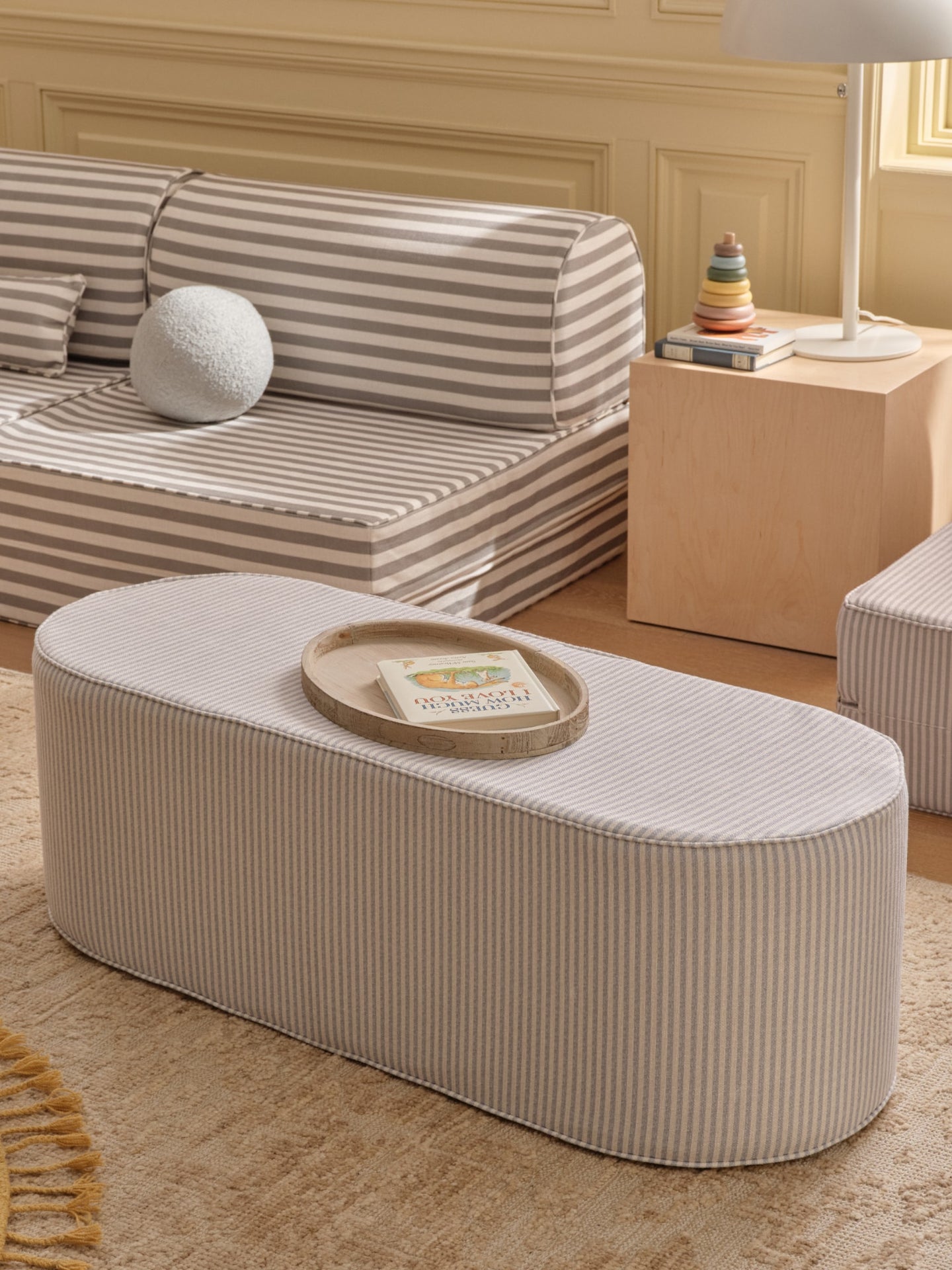 House of Noa striped play couches and coffee tables in a beige living room