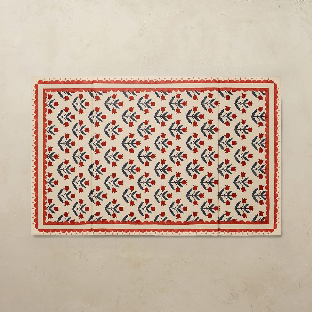 Delilah Carnation 4x6 tumbling mat with a deep red tulip pattern and scalloped red border on a cream base