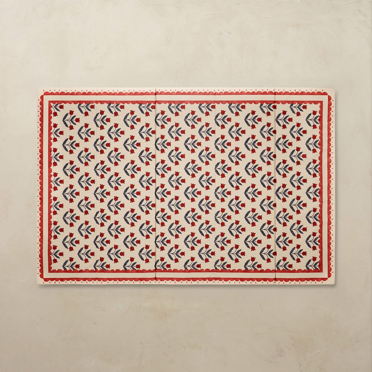 Delilah Carnation 5x7.5 tumbling mat with a deep red tulip pattern and scalloped red border on a cream base