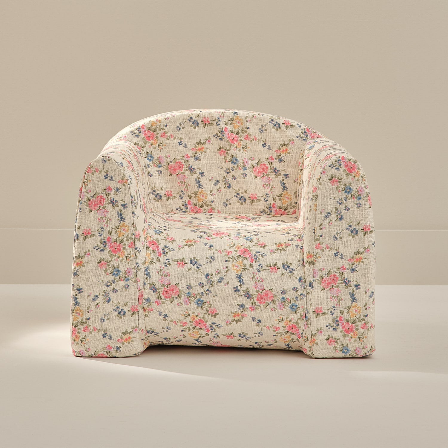 Floral patterned armchair on a neutral background