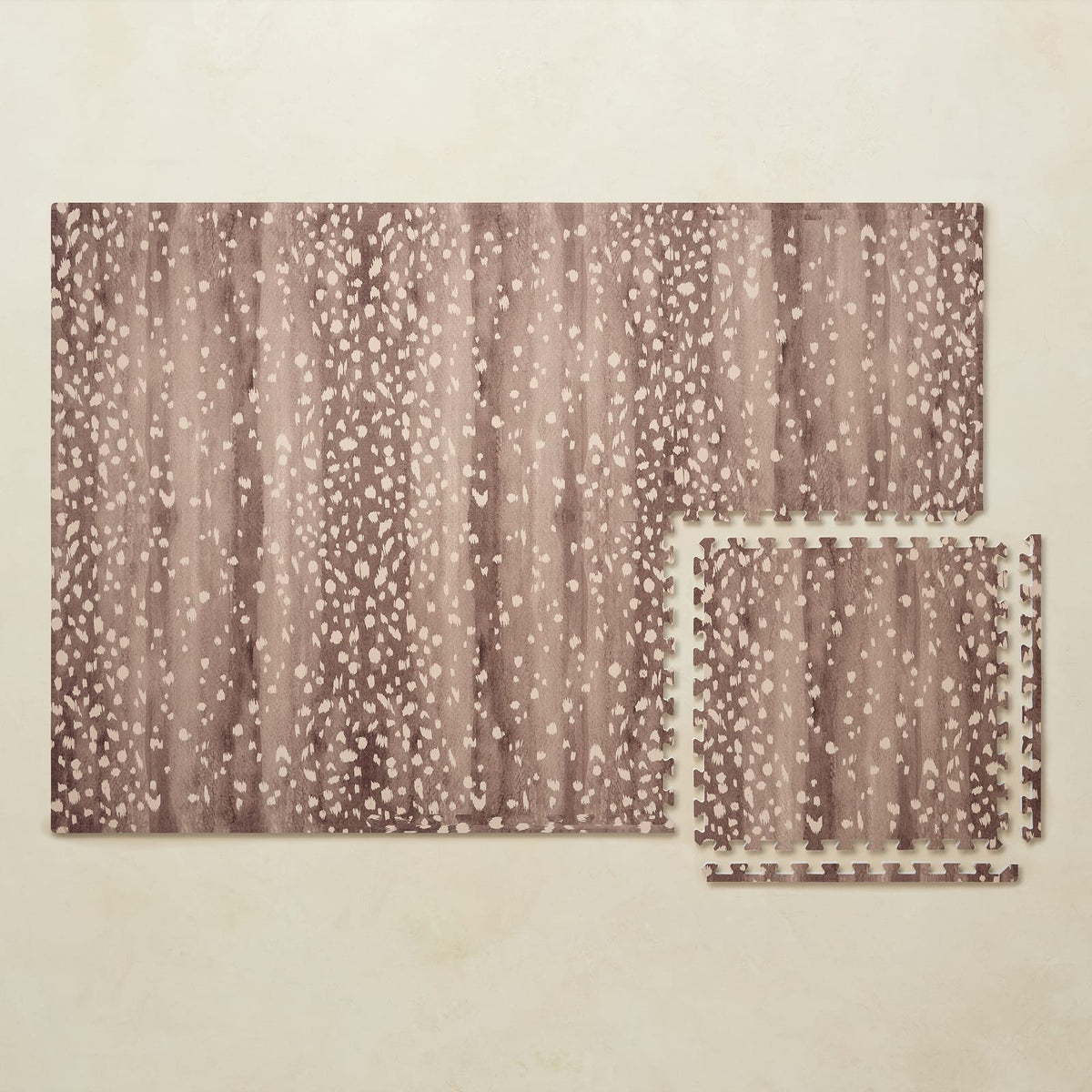 A 4x6 walnut brown Fawn foam play mat shown beside a single interlocking tile to compare sizes, photographed from above on a beige background.
