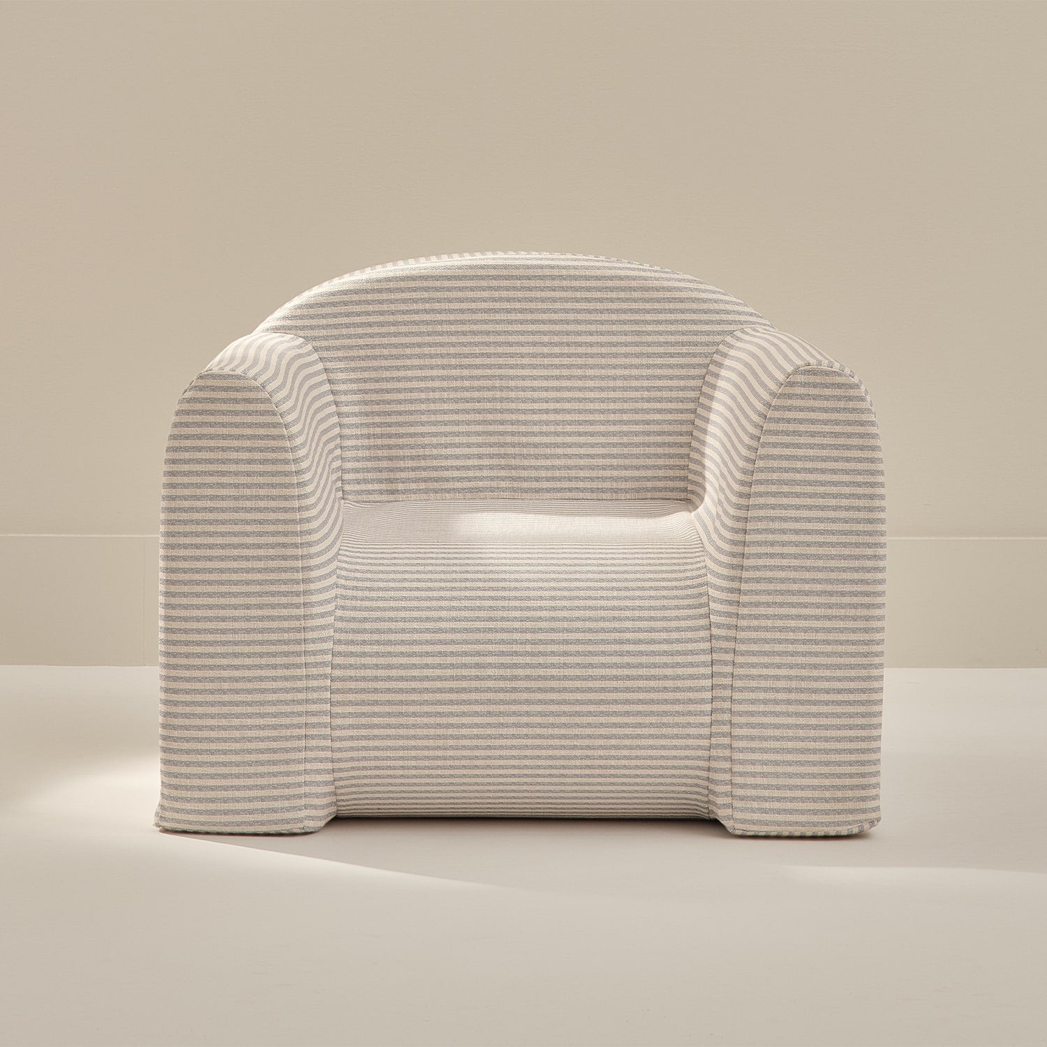 White textured armchair on a neutral background