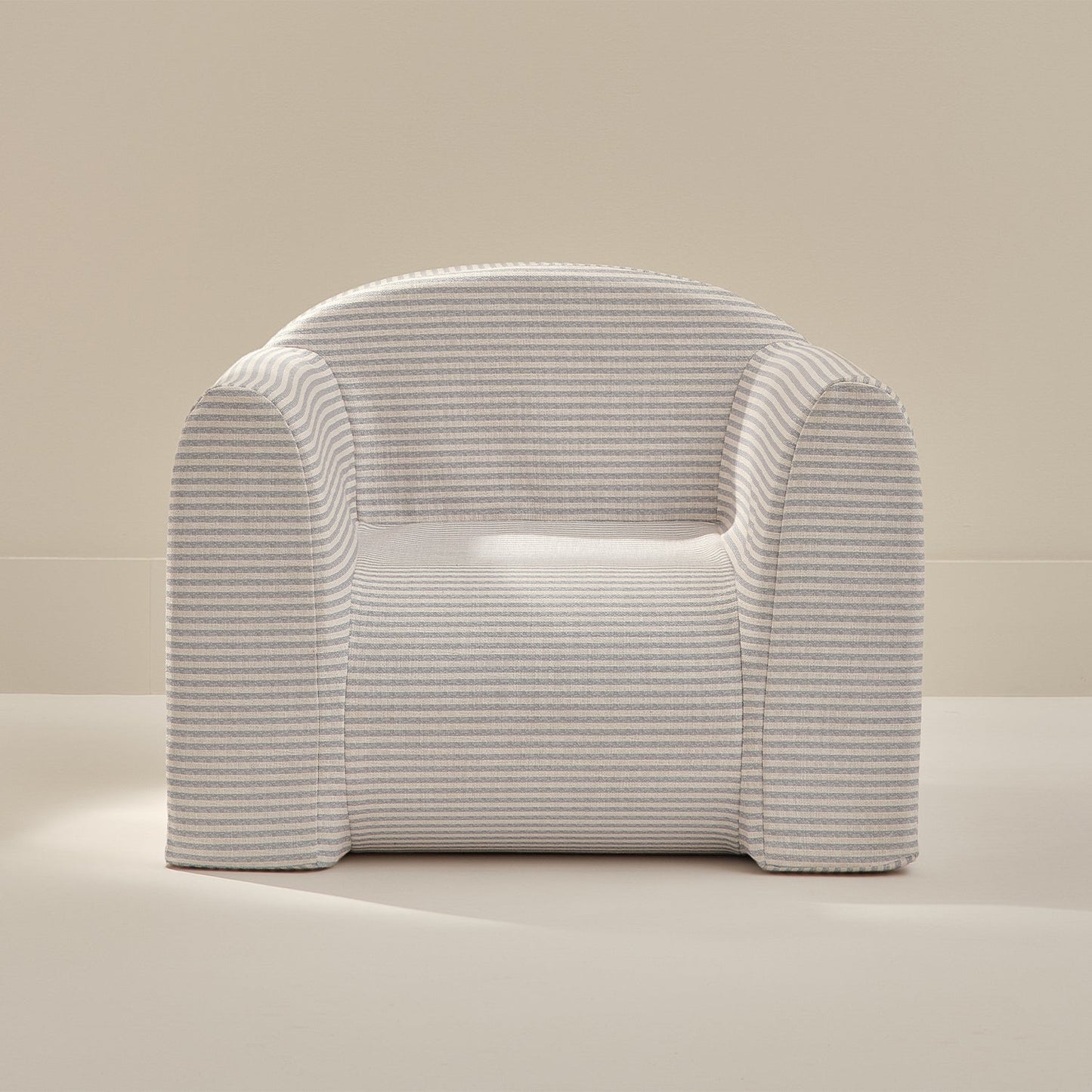Modern play chair with blue stripes on a neutral background