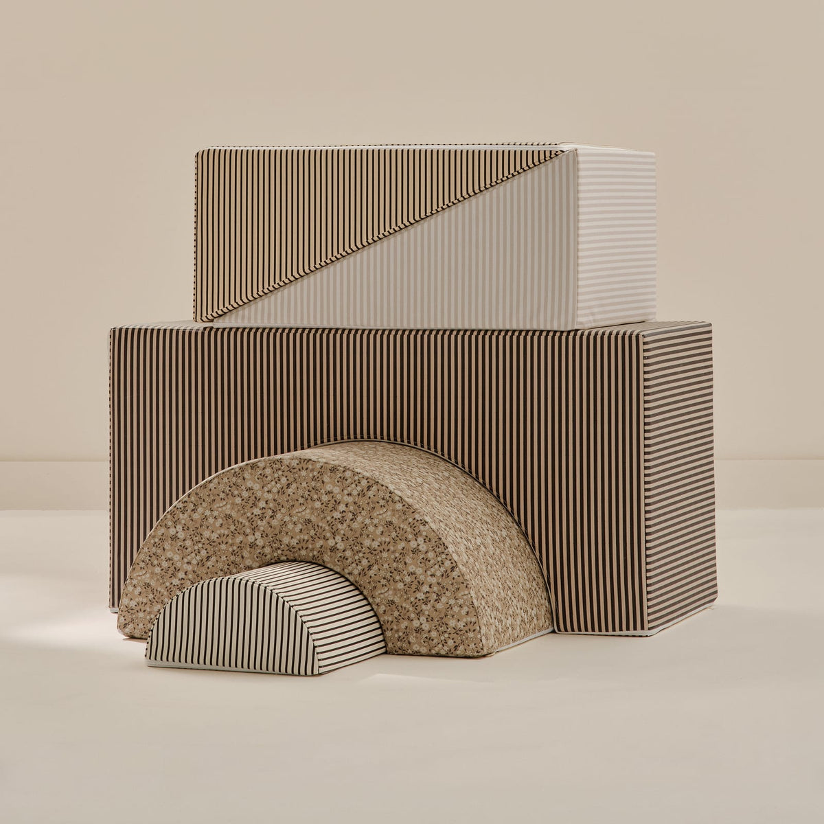 Rye Play Set Bundle: the complete Arch Set and Wedge Set in brown and tan stripes and florals on a beige background.