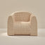 Beige grid pattern play chair on a beige background