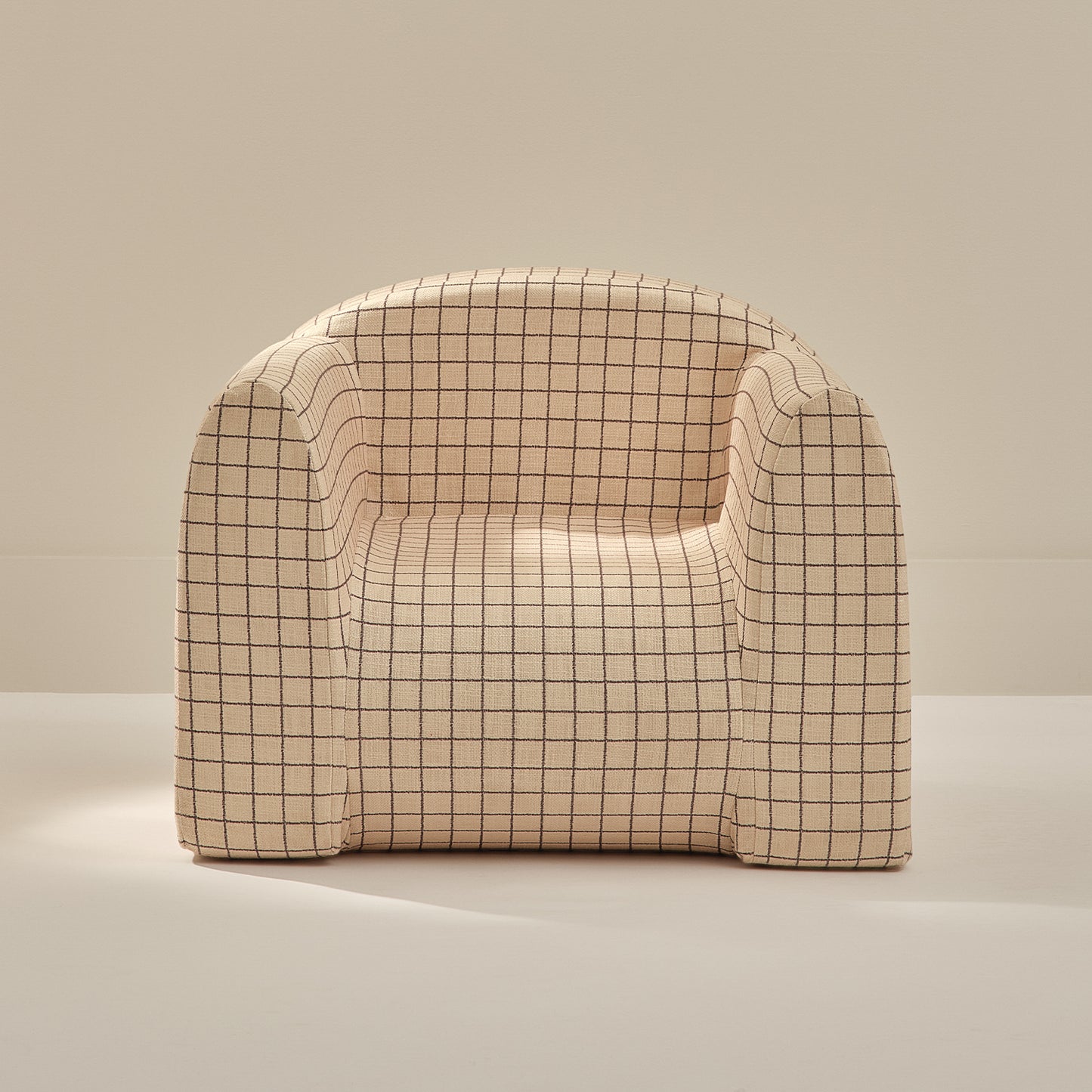 Beige grid pattern play chair on a beige background