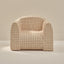Beige grid pattern play chair on a beige background