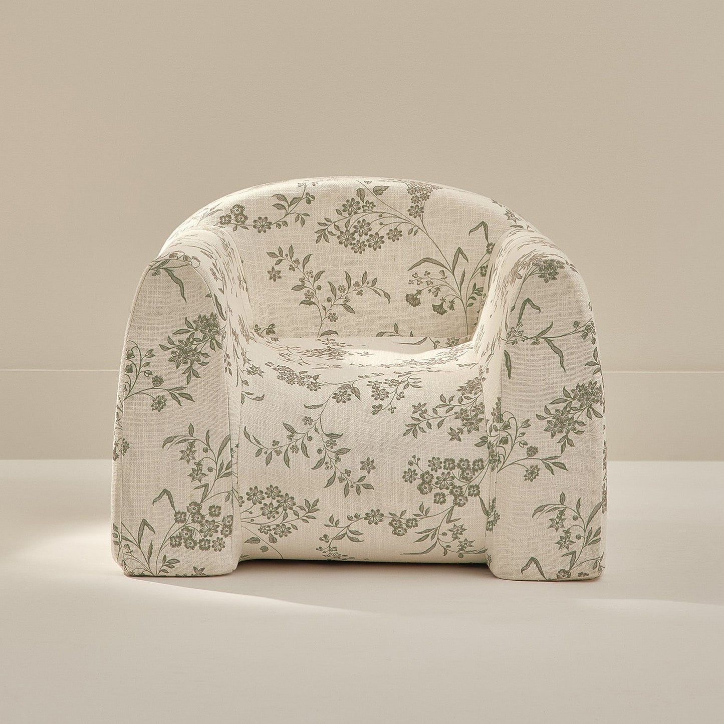 Floral patterned armchair on a neutral background