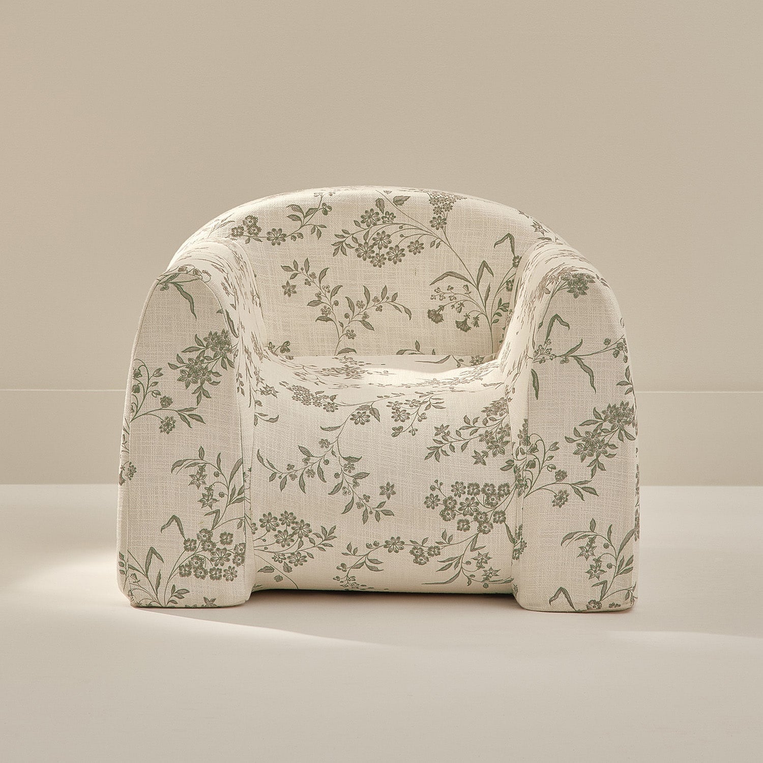 Floral patterned armchair on a neutral background