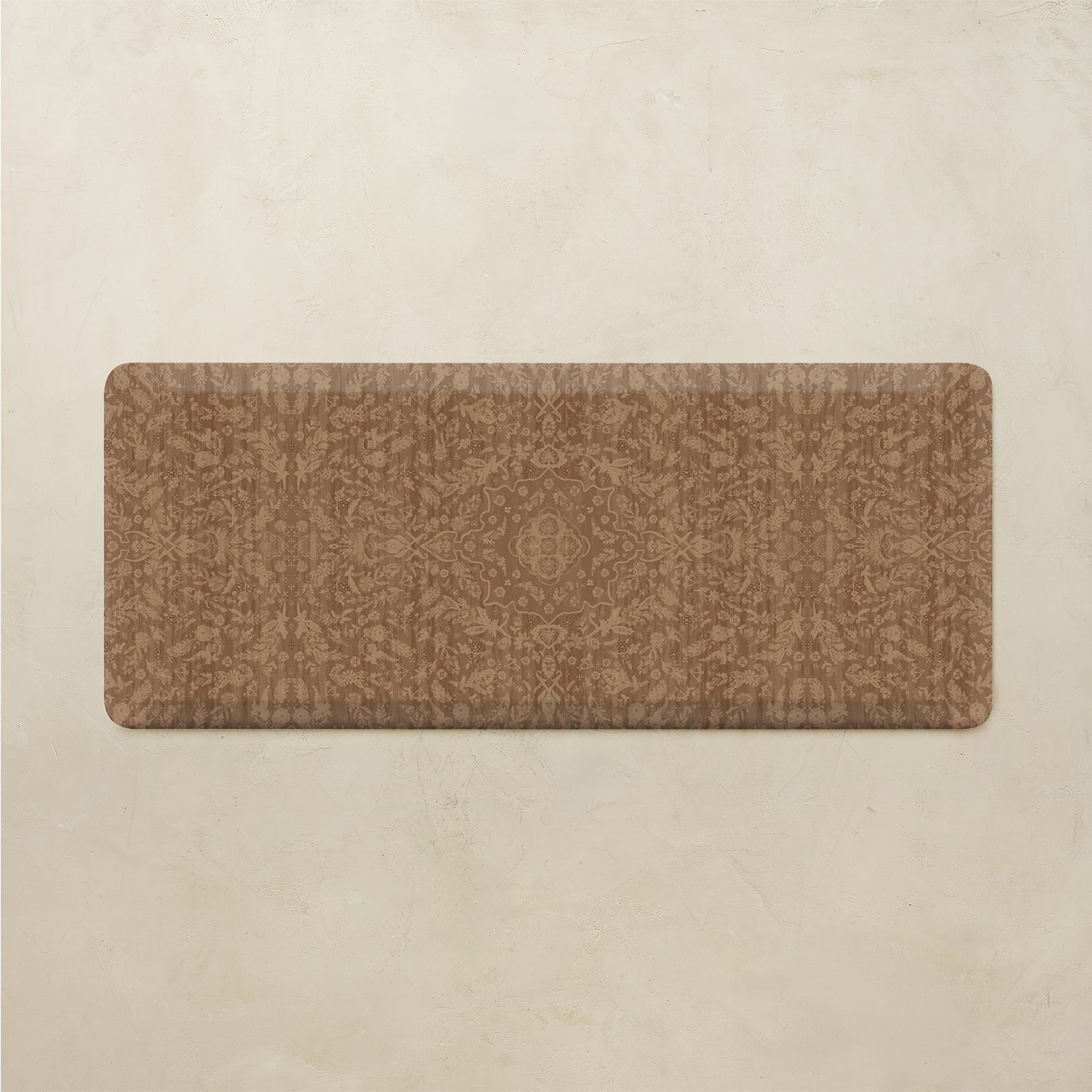 A rectangular brown kitchen rug with a subtle tonal damask pattern, displayed flat against a textured beige background.