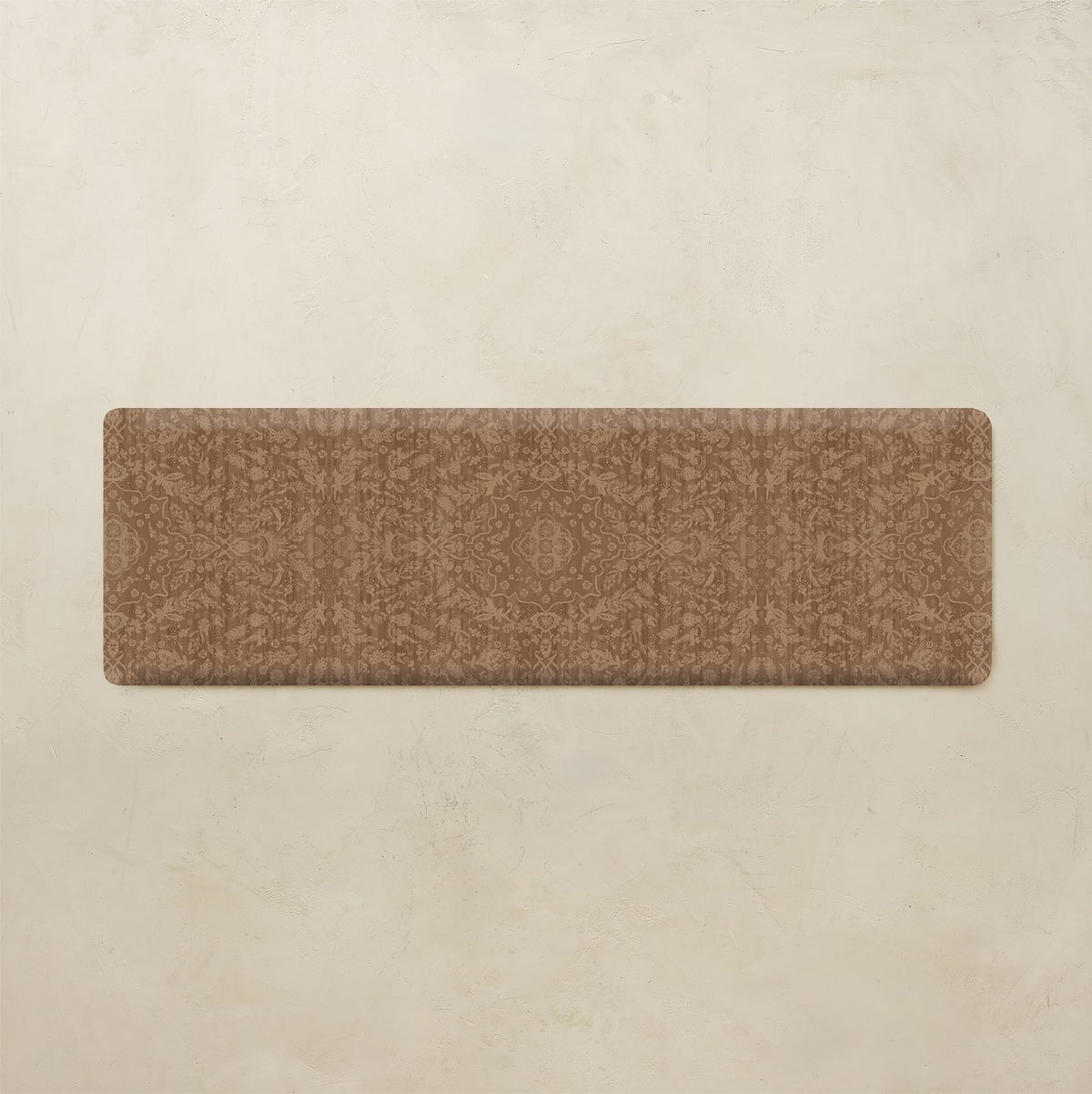 A rectangular brown runner rug with a subtle tonal damask pattern, displayed flat against a textured beige background.