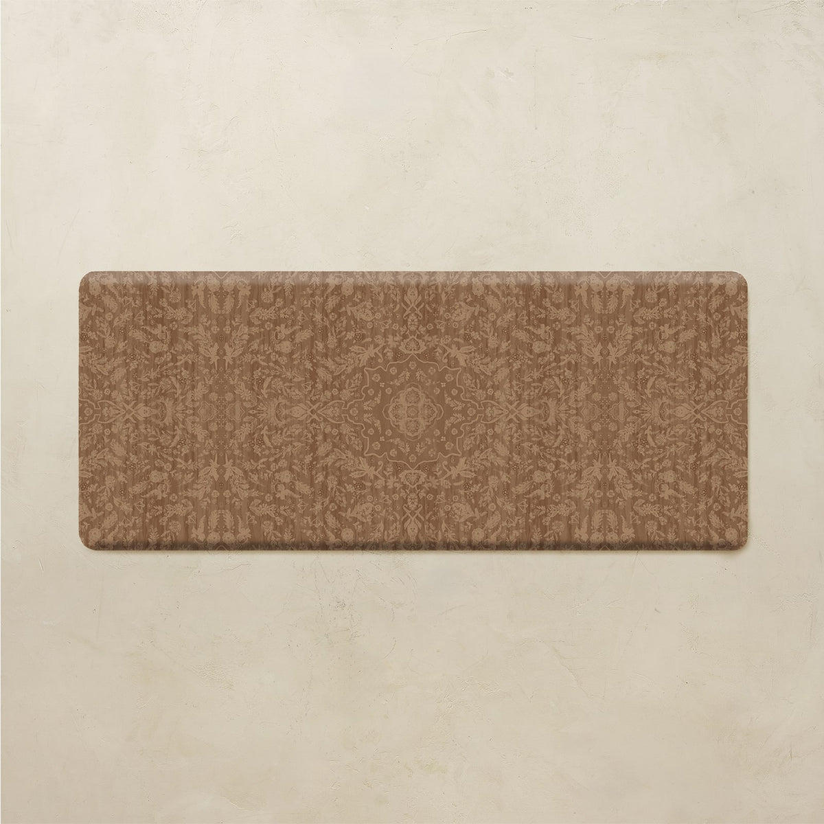 A rectangular brown kitchen runner rug with a subtle tonal damask pattern, displayed flat against a textured beige background.