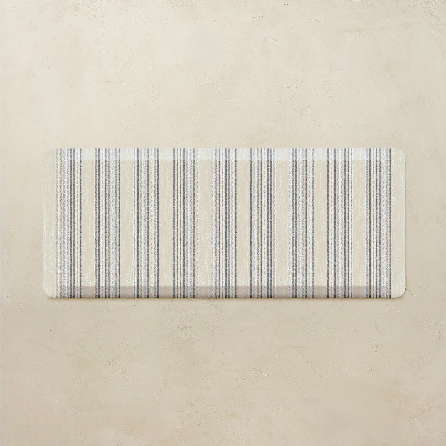 Rectangular mat with striped pattern on a beige background