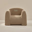 Beige textured armchair with 'Leo' embroidery on a neutral background