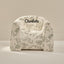 Floral-patterned chair with 'Charlotte' text on a beige background