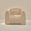 Beige checkered chair with 'Sebastian' branding on a beige background