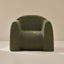 Green textured armchair on a beige background
