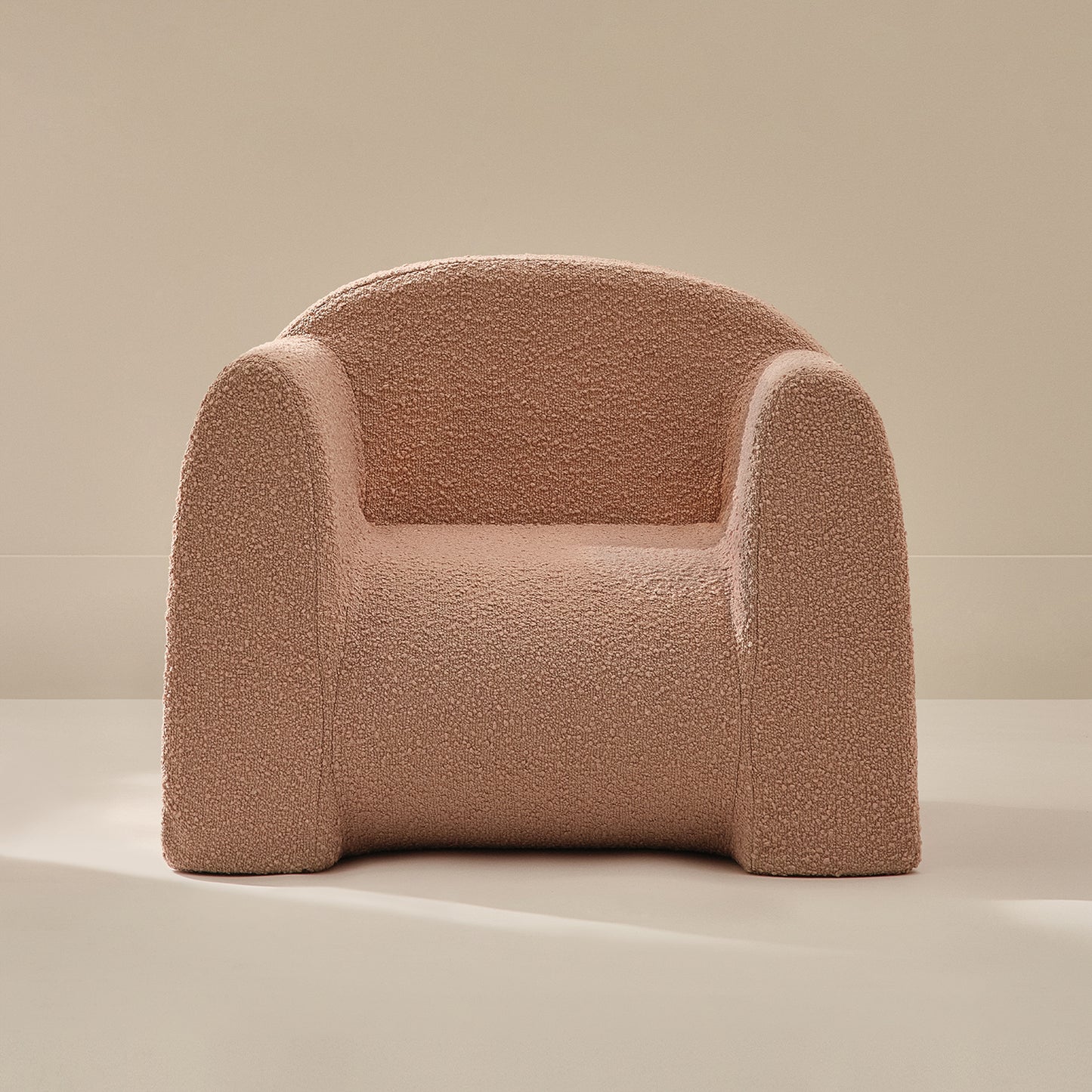 Pink textured armchair on a beige background