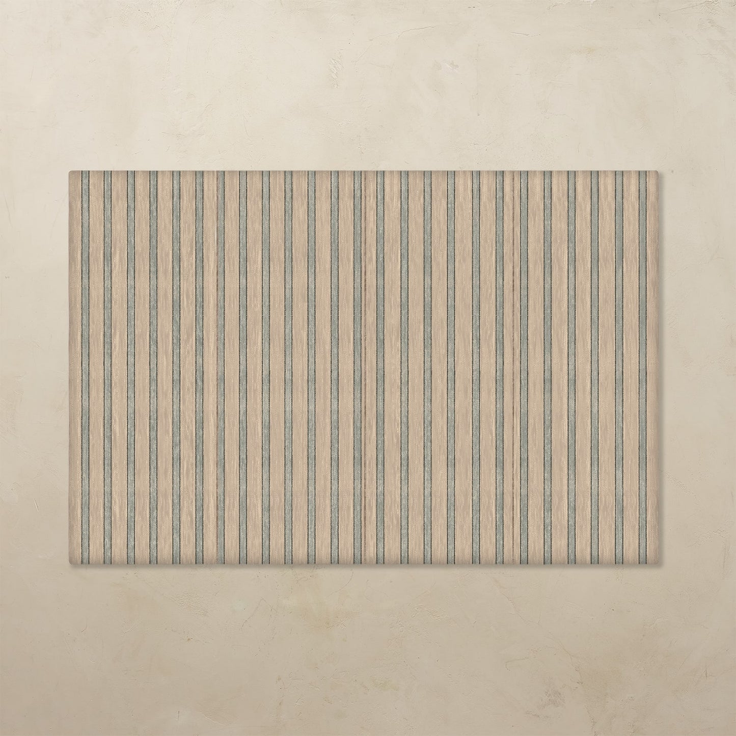 Rectangular tumbling mat with vertical stripes on a beige background