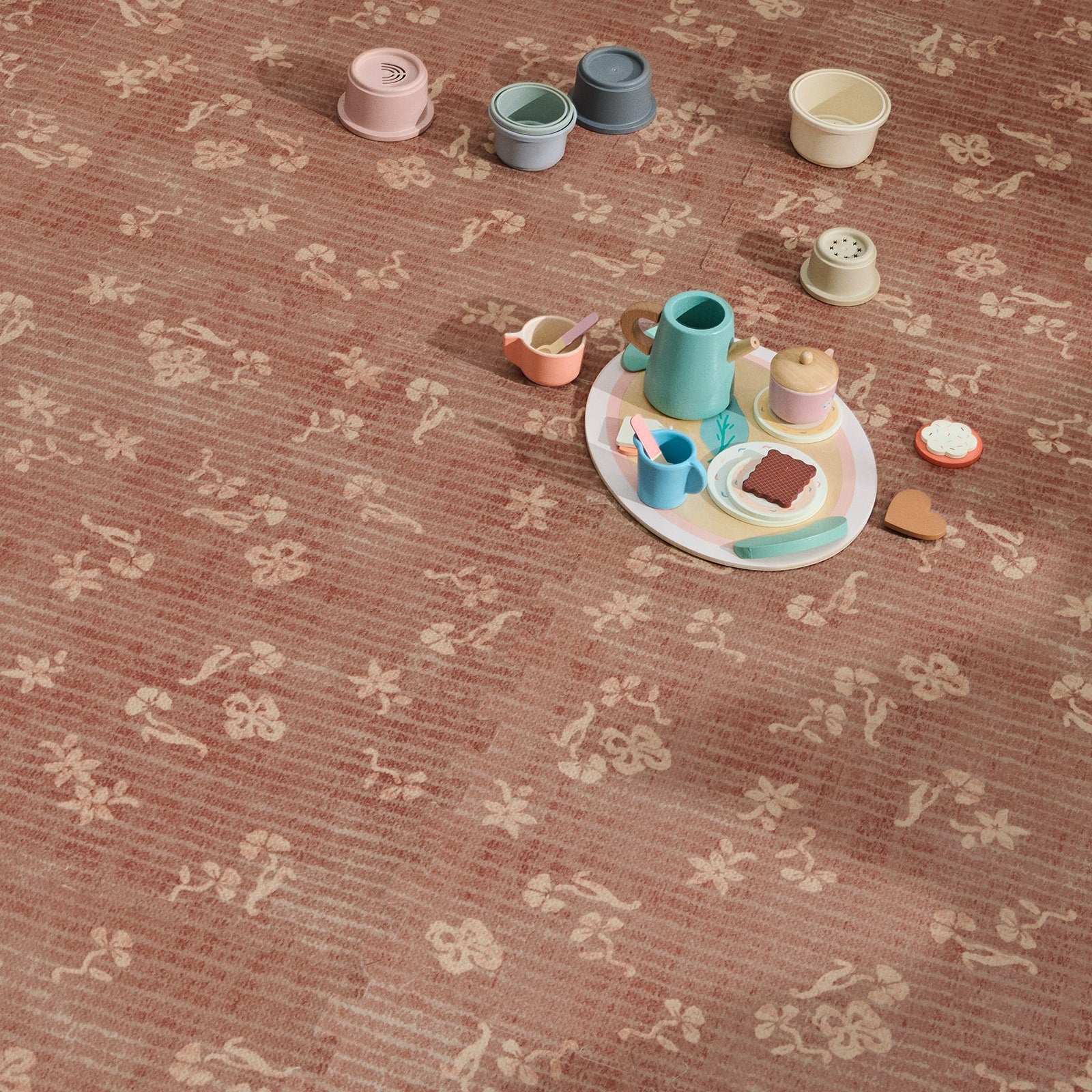 Colorful children's playset on a patterned play mat