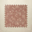 Floral patterned foam puzzle mat on a beige background