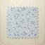 Floral blue patterned foam puzzle tile on a beige background