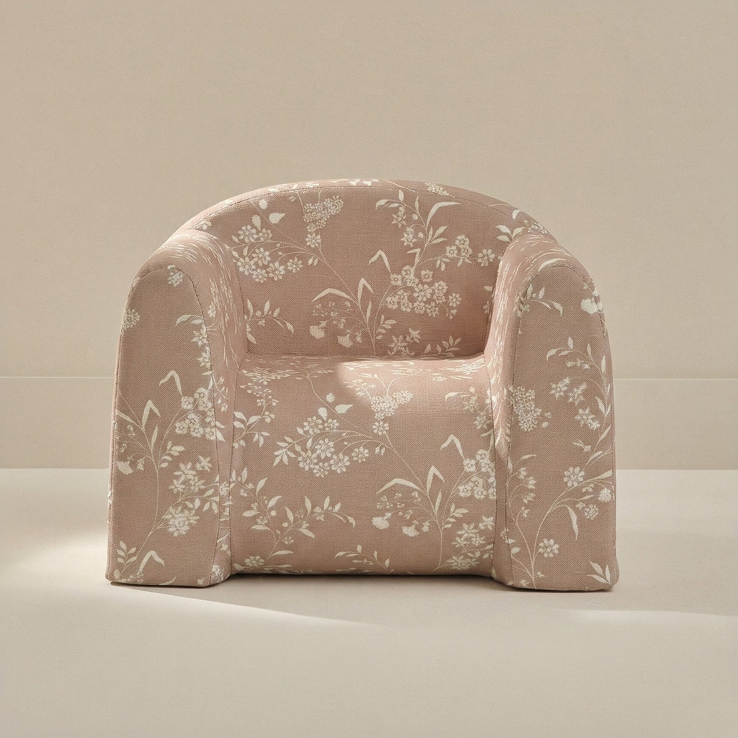 Floral-patterned armchair on a neutral background