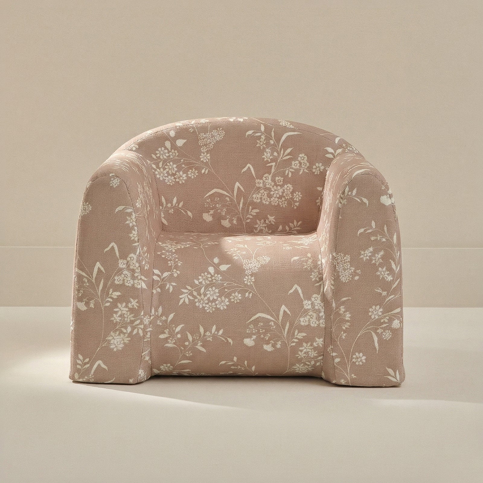 Floral-patterned armchair on a neutral background