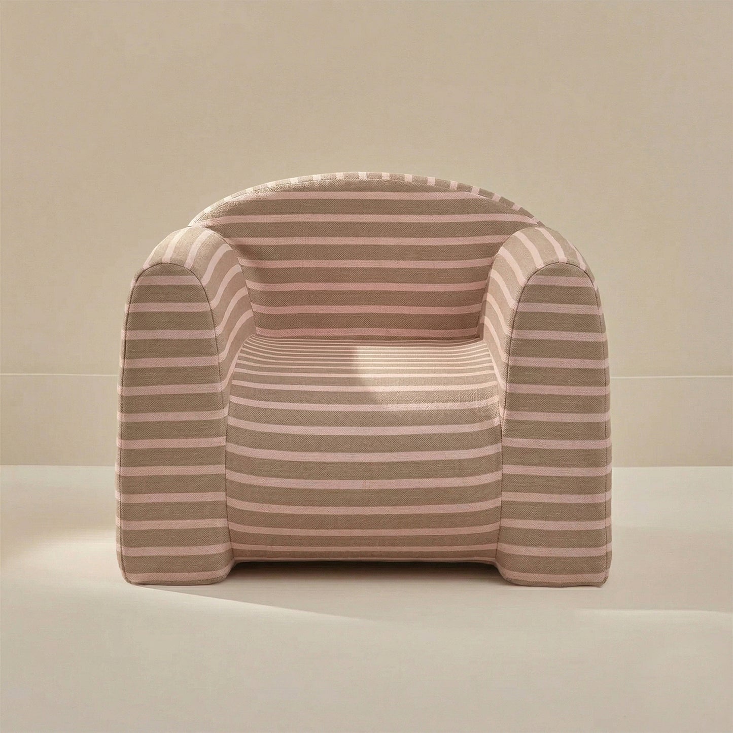 Striped armchair with pink and beige stripes on a neutral background