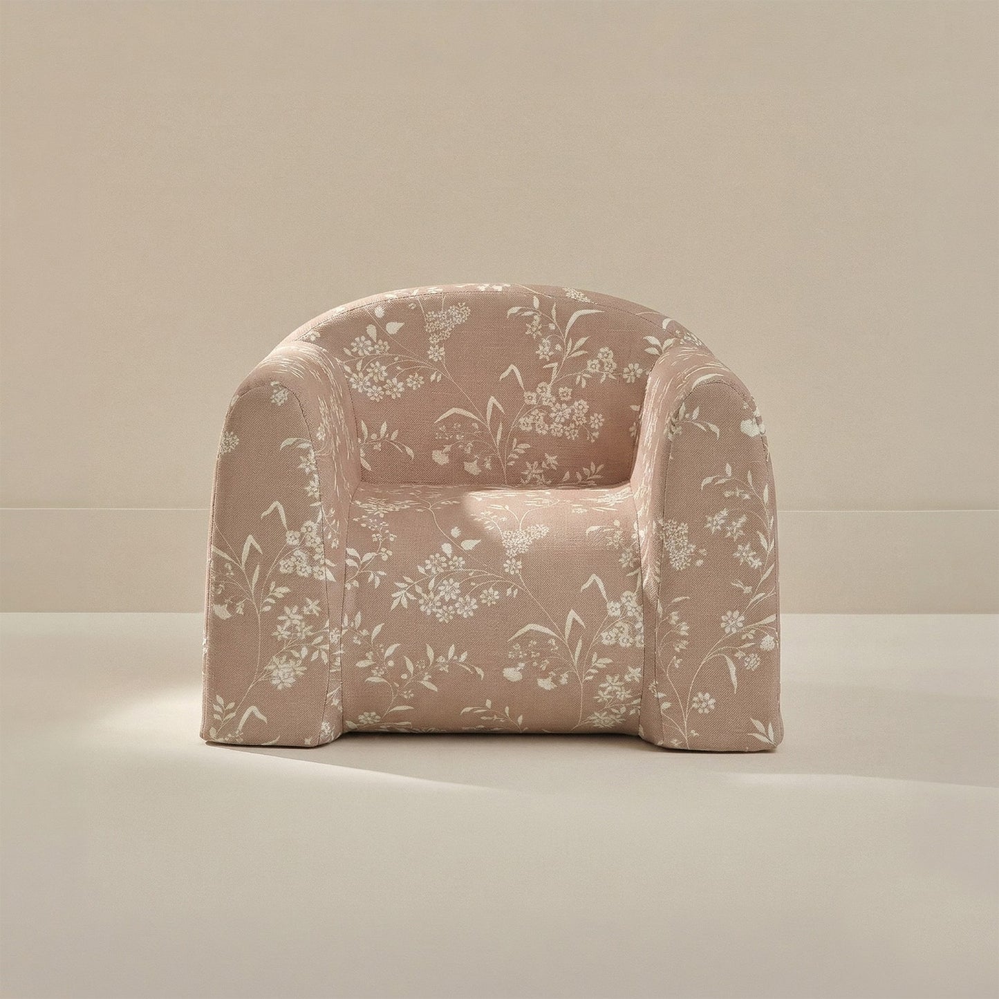 Floral-patterned armchair on a neutral background