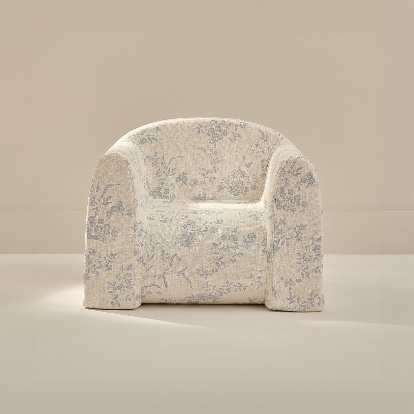 Floral-patterned play chair on a neutral background