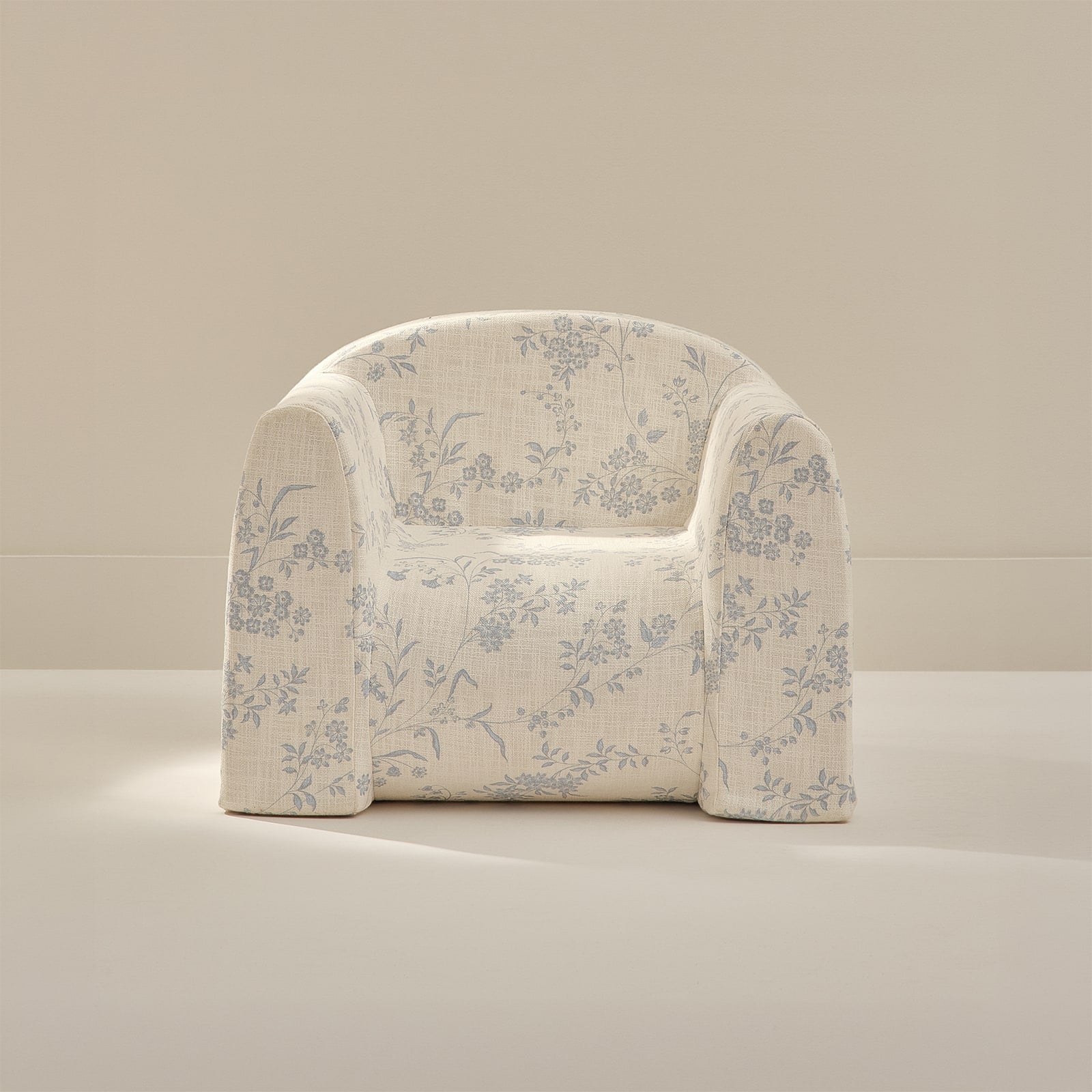 Floral-patterned play chair on a neutral background