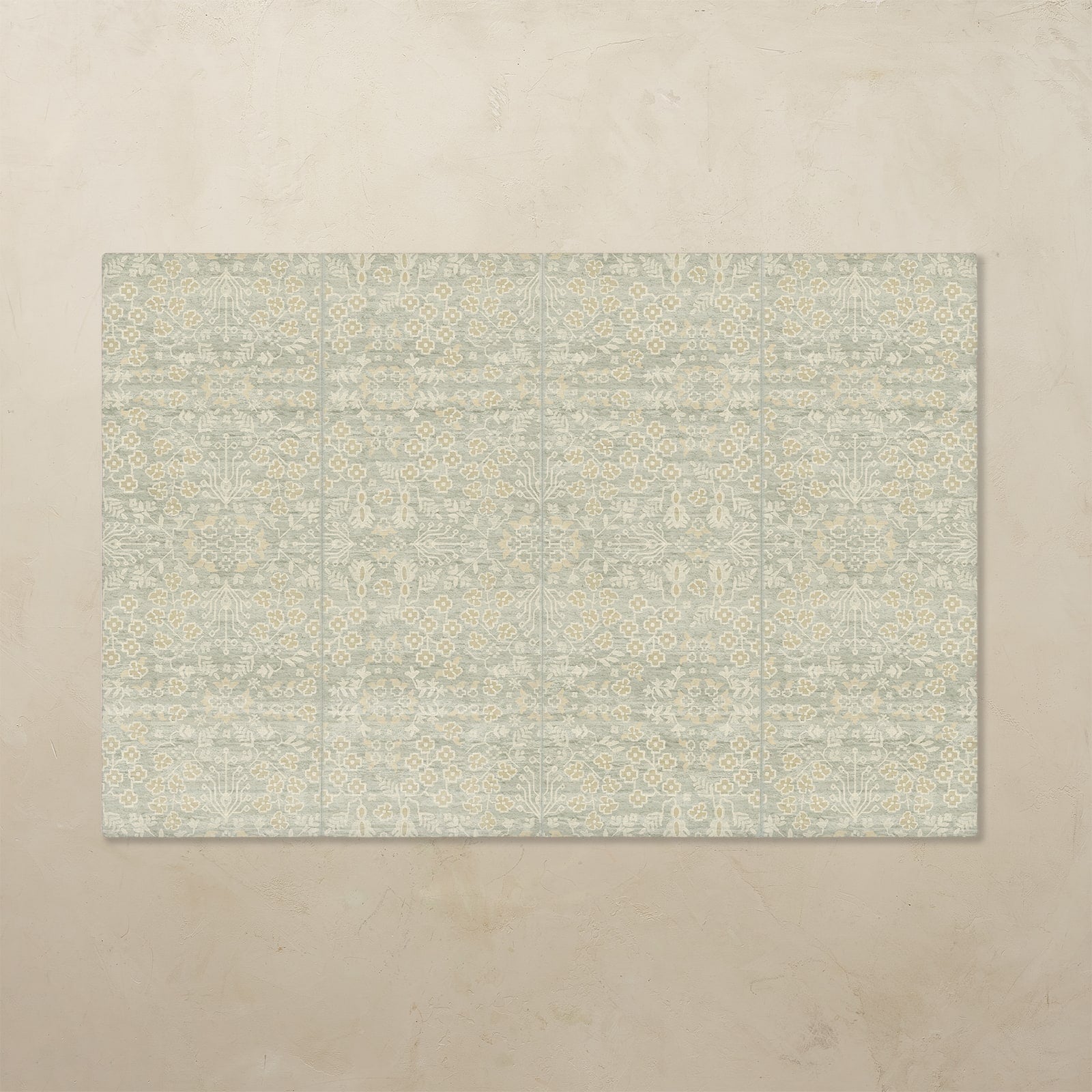 Rectangular tumbling mat with a subtle pattern on a beige background