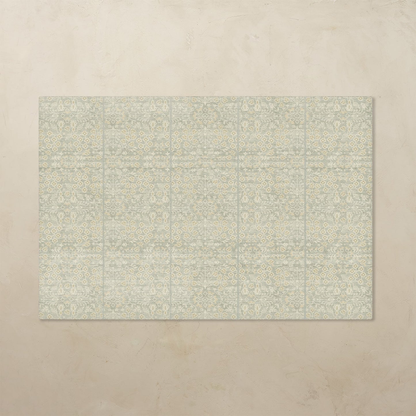 Rectangular tumbling mat with a subtle pattern on a beige floor.