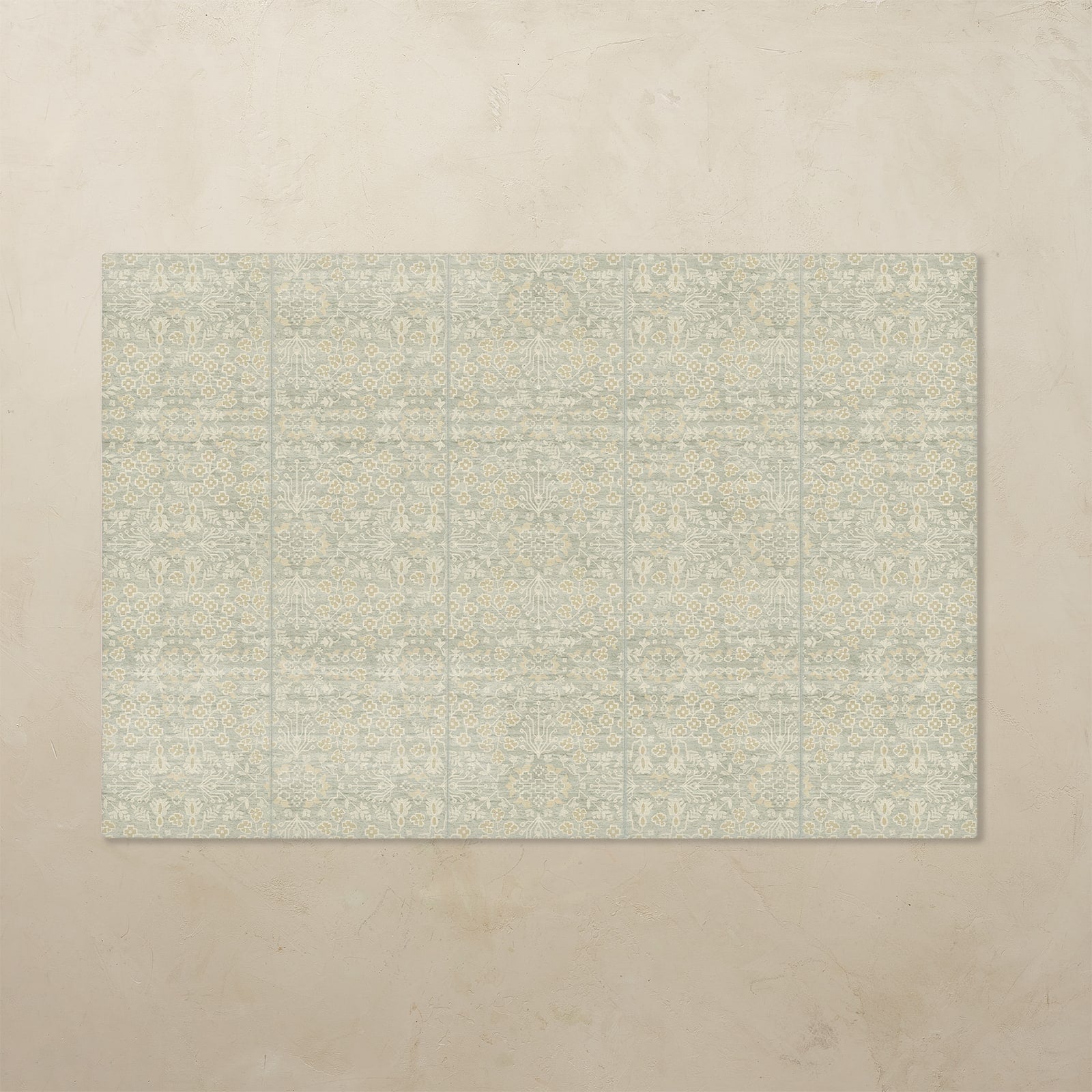 Rectangular tumbling mat with a subtle pattern on a beige floor.