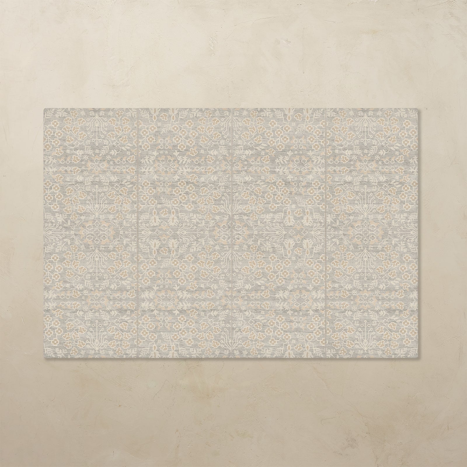 Rectangular tumbling mat with a subtle pattern on a beige floor