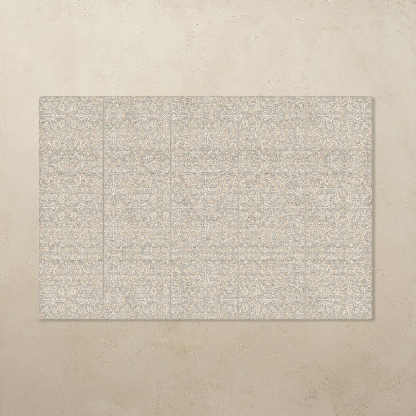 Beige tumbling mat with a subtle pattern on a beige background