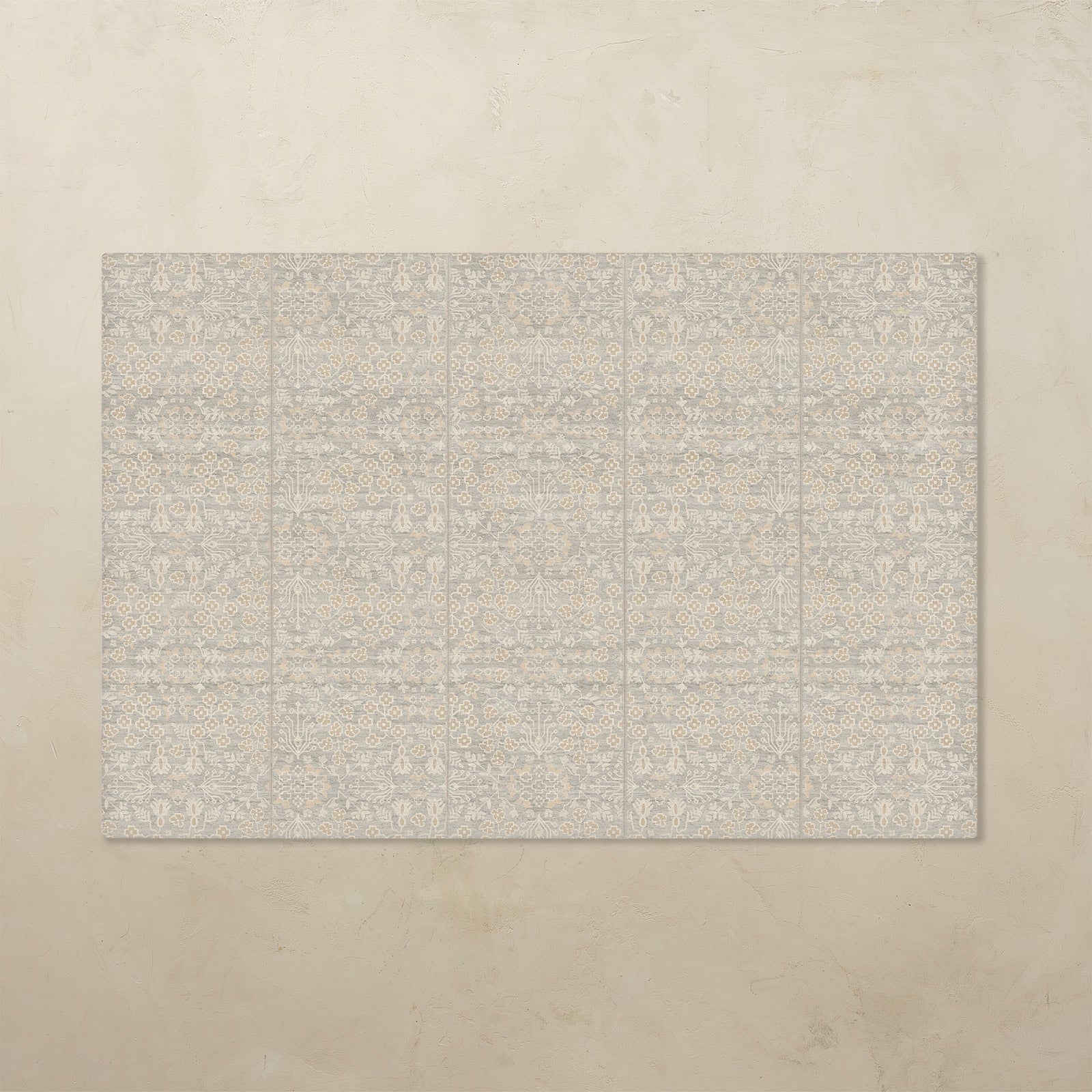 Beige tumbling mat with a subtle pattern on a beige background