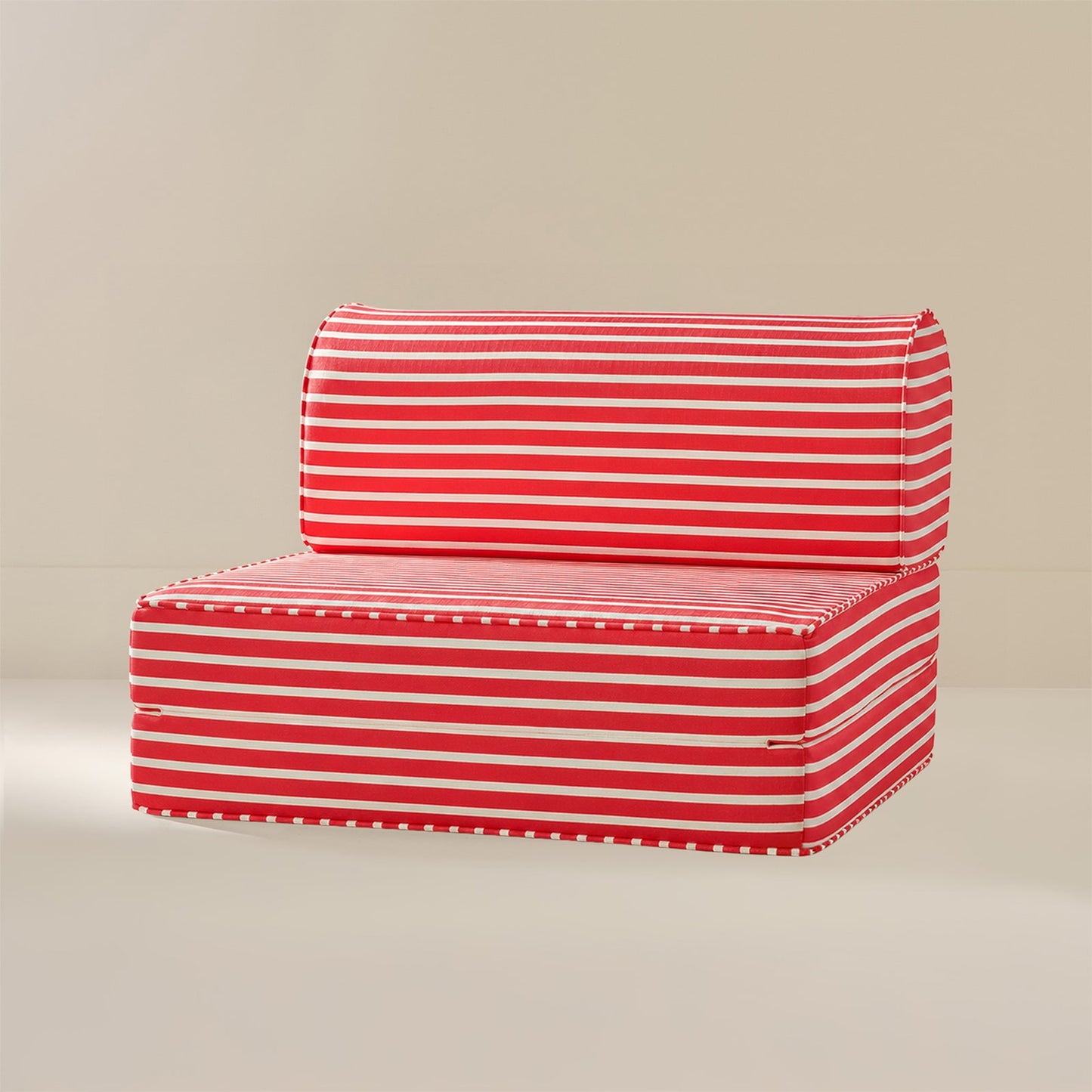 Red and white striped outdoor patio cushion set with a low-profile seat and matching backrest, shown on a neutral beige background.