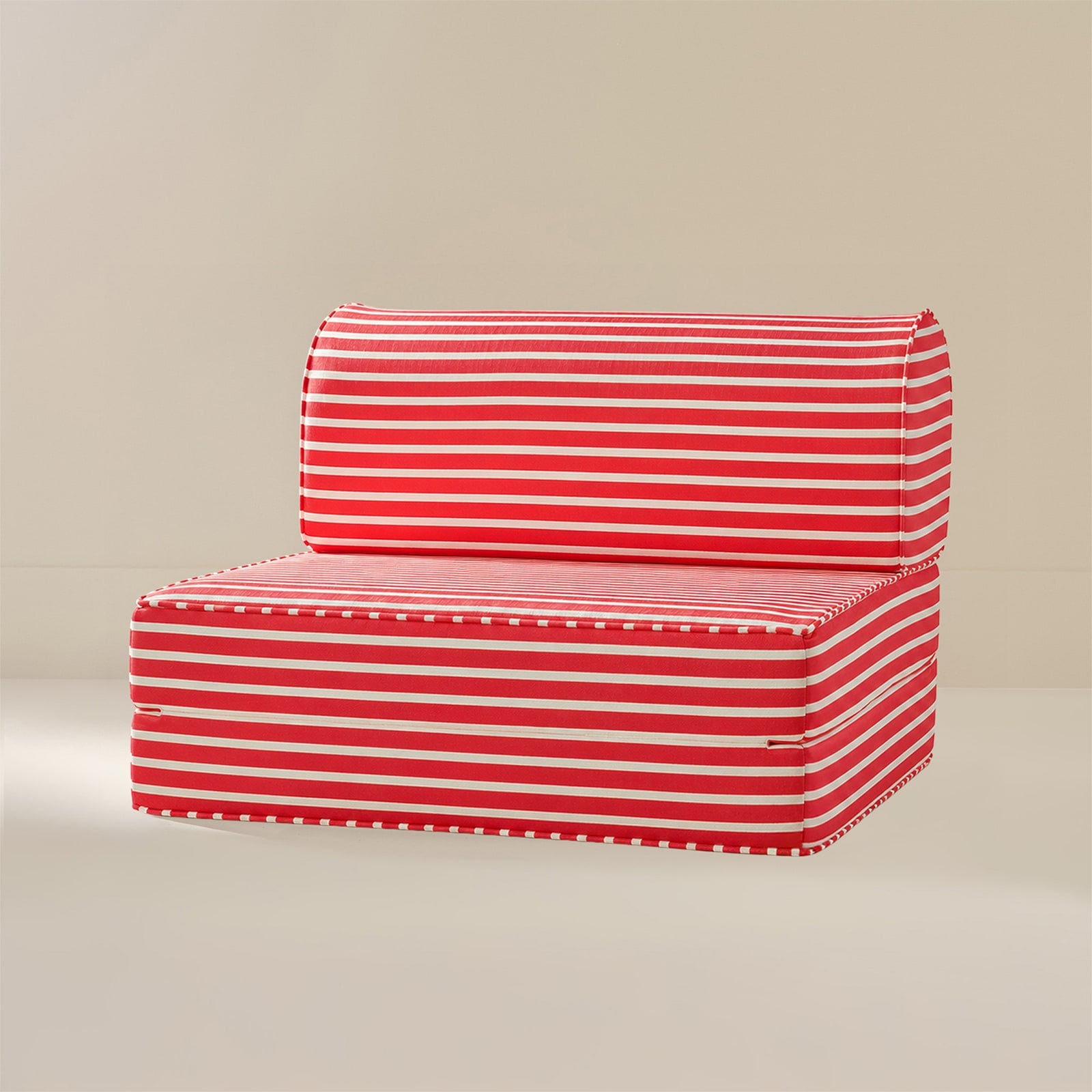 Red and white striped outdoor patio cushion set with a low-profile seat and matching backrest, shown on a neutral beige background.