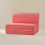 Red and white striped outdoor patio cushion set with a low-profile seat and matching backrest, shown on a neutral beige background.