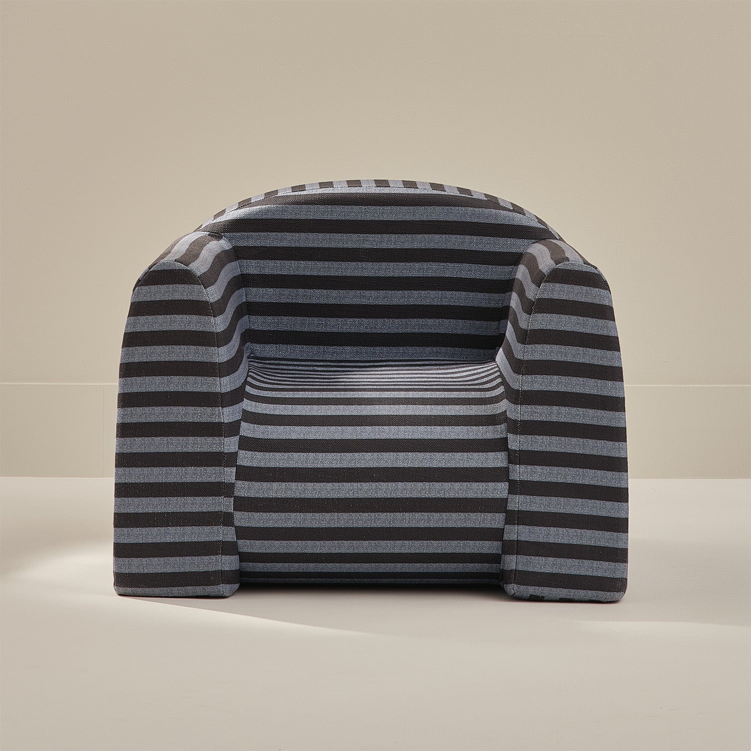 Striped cushion with a geometric pattern on a beige background