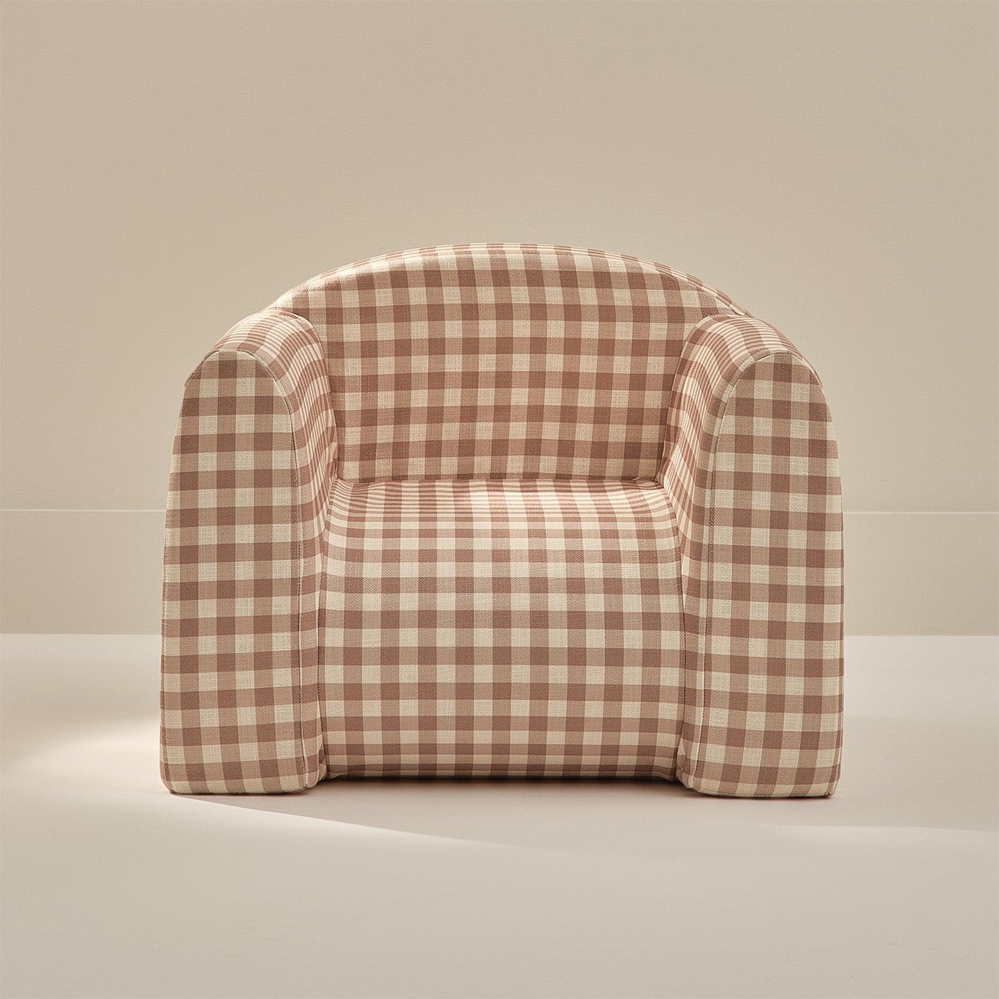 Checkered armchair on a beige background