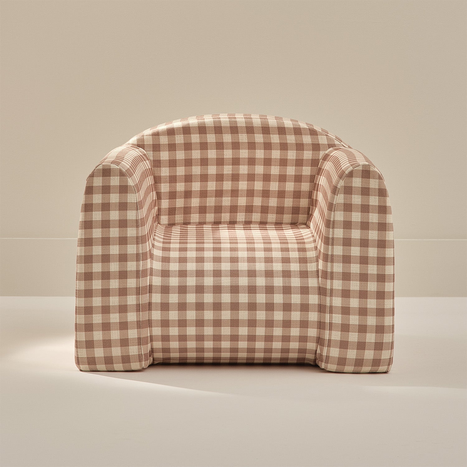 Checkered armchair on a beige background