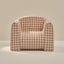 Checkered armchair on a beige background