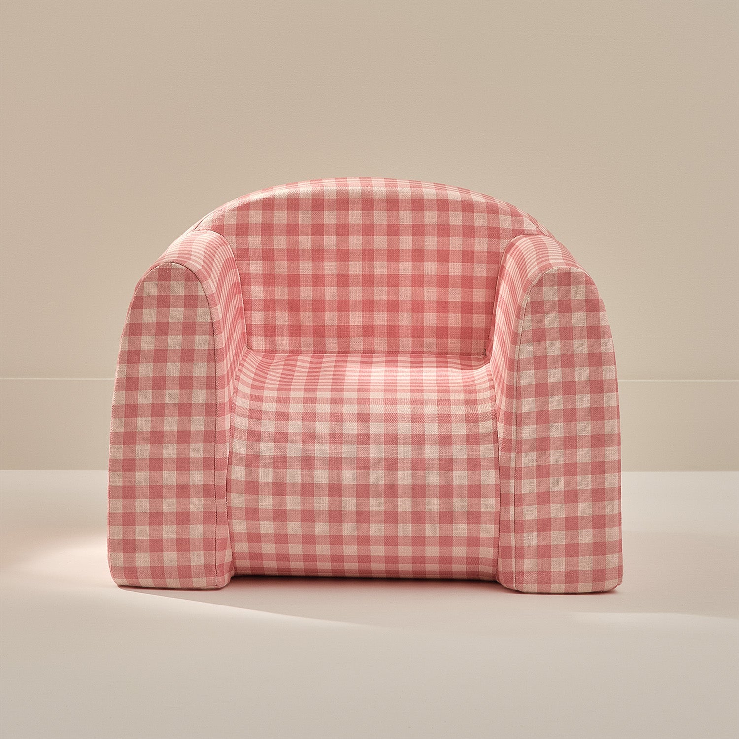 Pink and white checkered chair on a beige background